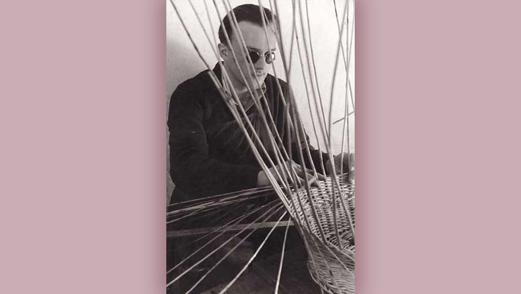 Blind man weaving basket
